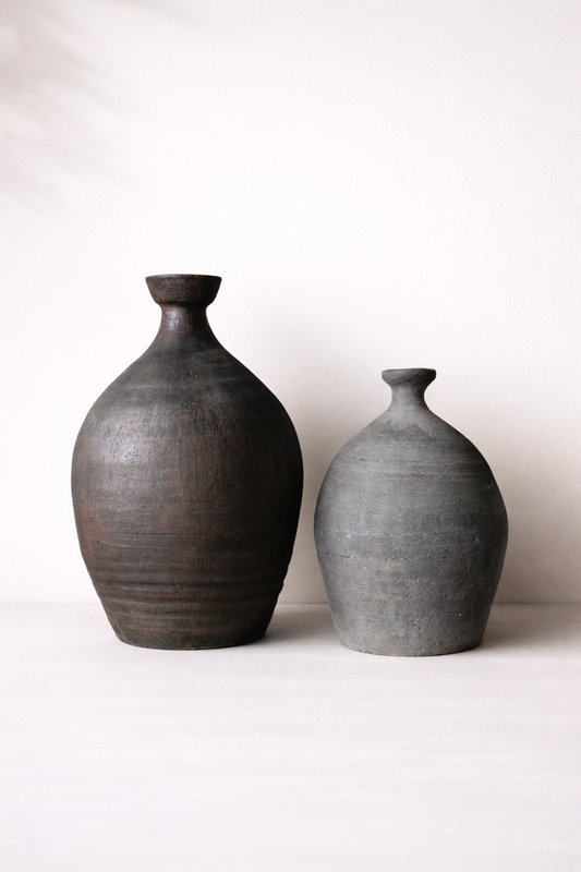 Two ceramic vases on a white background