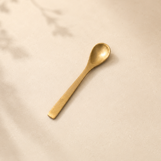 Brushed brass kitchen spoon by Luxe B Co with a sleek, modern design ideal for cooking and serving.