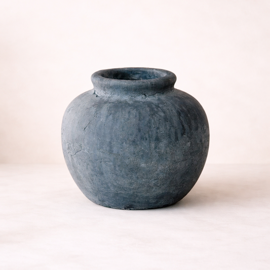 Blue ceramic vase on a white background