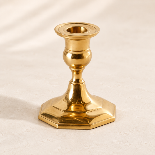 Gold antique-inspired candle holder by Luxe B Co. featuring ornate design and classic candlestick style for elegant decor.