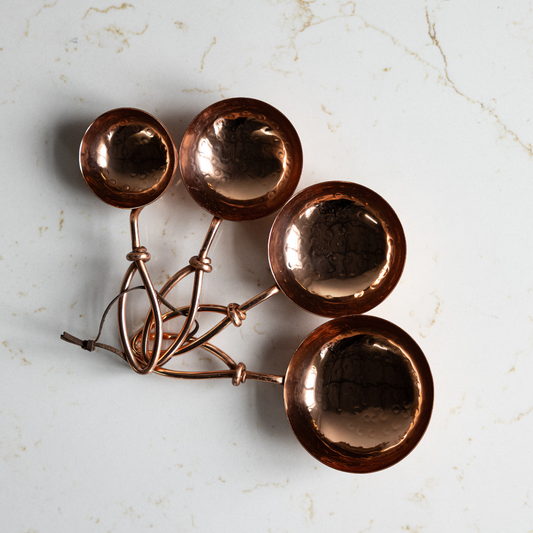 Hammered stainless steel scoop by Creative Co-op with a polished finish, designed for serving or measuring.