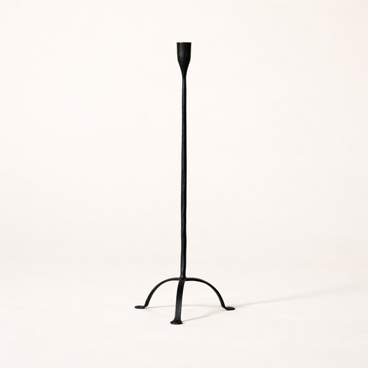 Hand-forged cast iron candleholder with footed design, small taper holder from Creative Co-op, showcasing rustic craftsmanship.