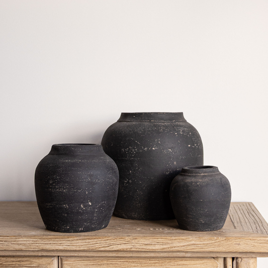 Black wash round terracotta vase by Luxe B Co, featuring a smooth, rounded design perfect for modern decor.