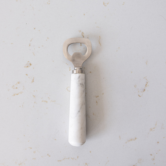 Marble bottle opener tool from Luxe B Co with a sleek, polished marble design and metal opener for easy bottle opening.
