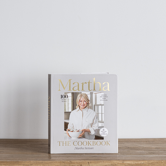 Martha The Cookbook by Luxe B Co featuring a hardcover with colorful food images on the cover.