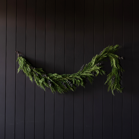 Navy plum frosted berry Norfolk cypress real touch Christmas garland, 6 ft, with lush greenery and frosted berry accents.