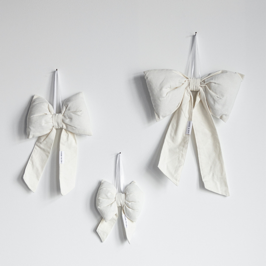 White canvas bows from Luxe B Co, stylish and soft fabric bows with a classic design, perfect for accessories or gift wrapping.