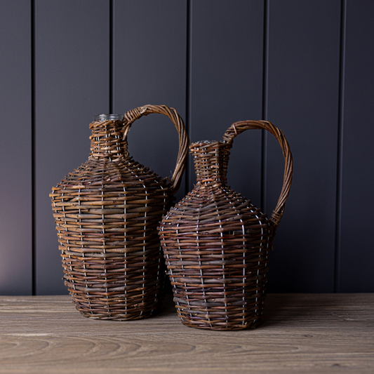 Decorative willow wrapped jug by Luxe B Co, showcasing a handcrafted ceramic vessel with woven willow accents.