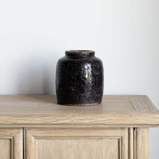 Black ceramic vase by Luxe B Co with a sleek, vintage-inspired design perfect for home decor accents.