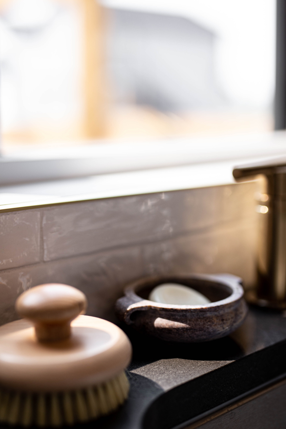 Marble soap dish from Luxe B Co featuring a smooth soapstone design, ideal for holding soap in bathroom or kitchen.