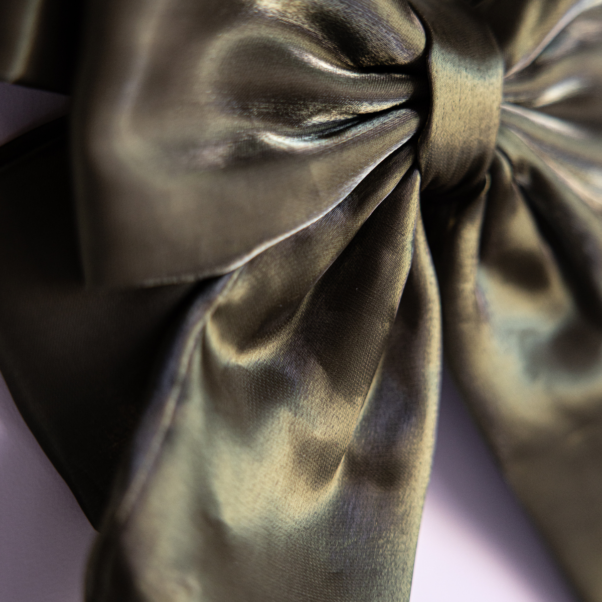 Olive green gauze bow from Luxe B Co featuring a bold, stylish design with soft, lightweight fabric and a large, statement bow shape.