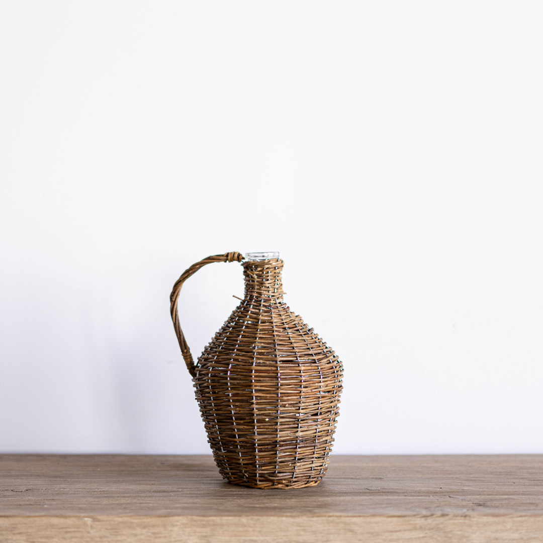Willow wrapped decorative wine bottle jug by Porch View Home, handcrafted with natural willow for rustic home decor.