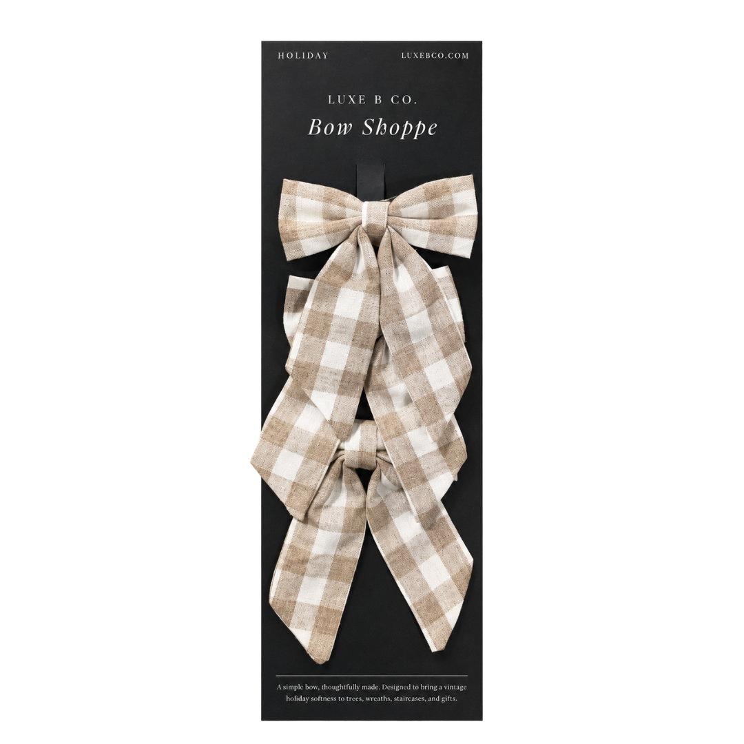 Set of beige gingham mini fabric bows with clips from Luxe B Co, perfect for hair accessories or decorative use.