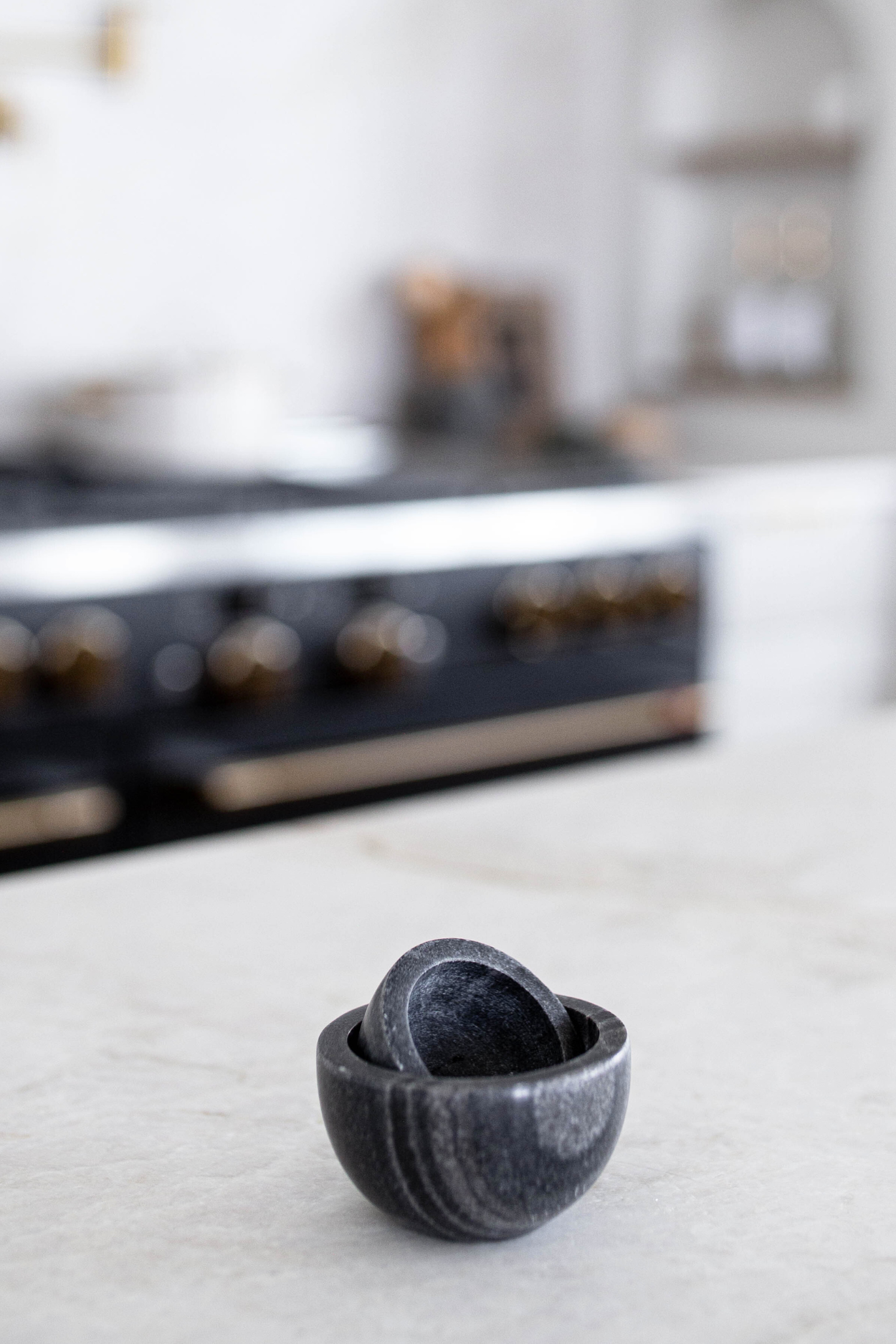 Gray marble dish with a smooth, polished surface from Luxe B Co, featuring natural stone turned texture for elegant serving.