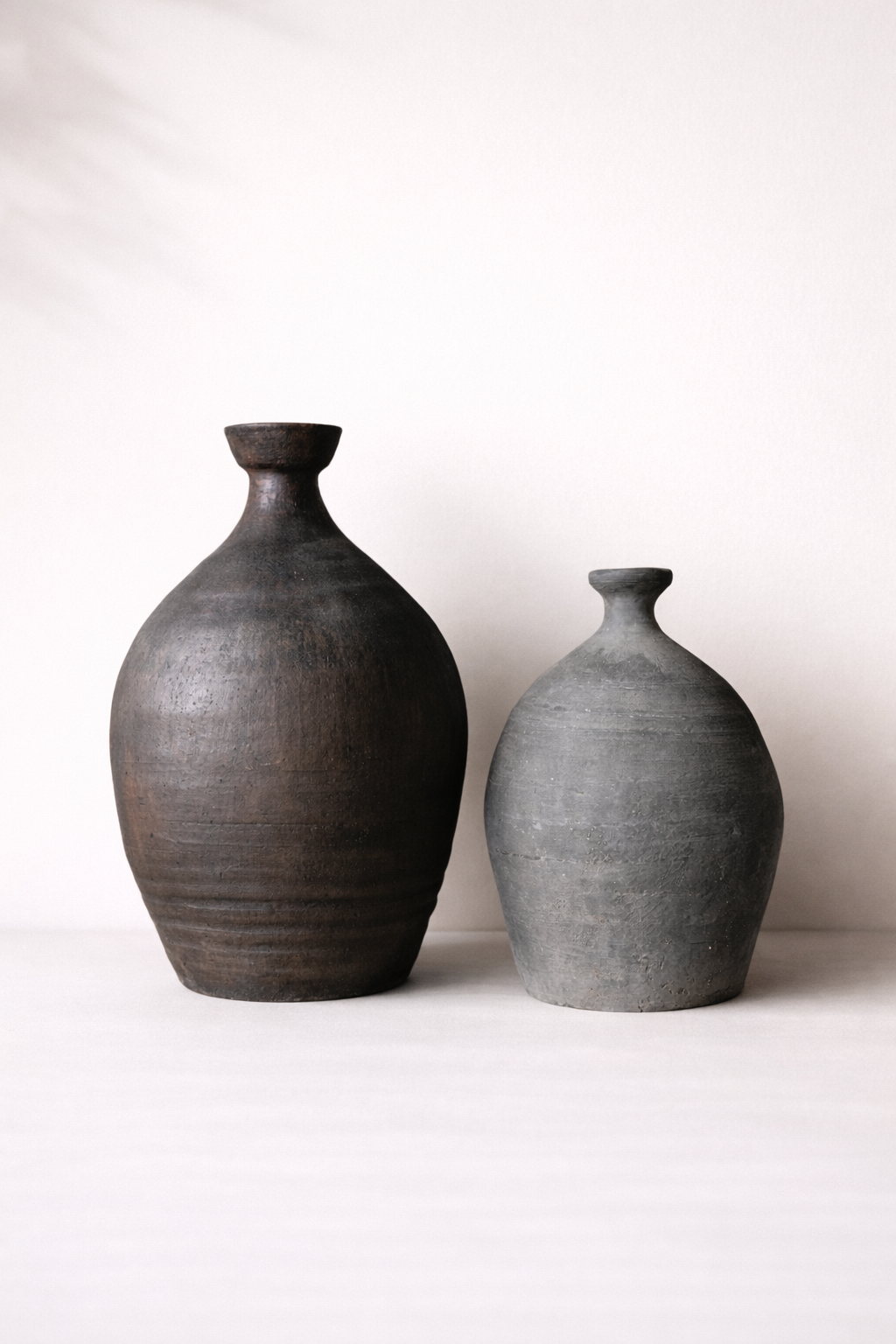 Two ceramic vases on a white background