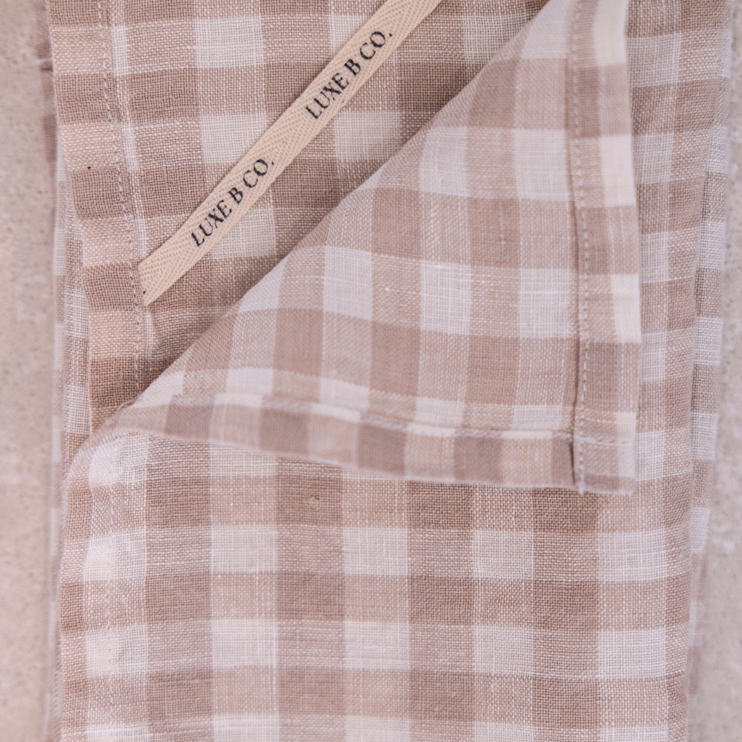 Beige gingham linen dish towels from Luxe B Co, set of elegant napkins for kitchen and table decor.