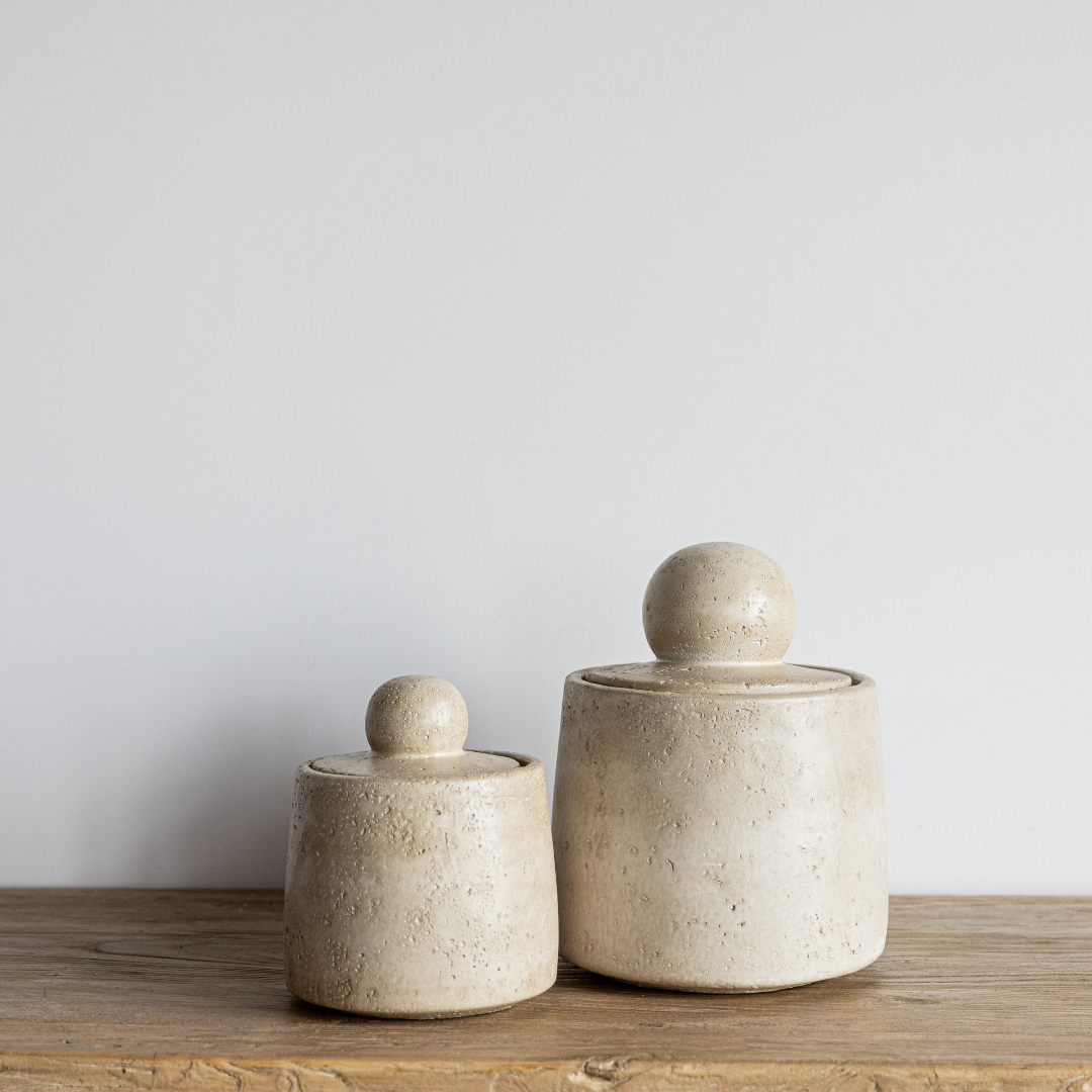 Beige travertine cement canister decorative object by Luxe B Co, showcasing a smooth, modern design suitable for home decor.