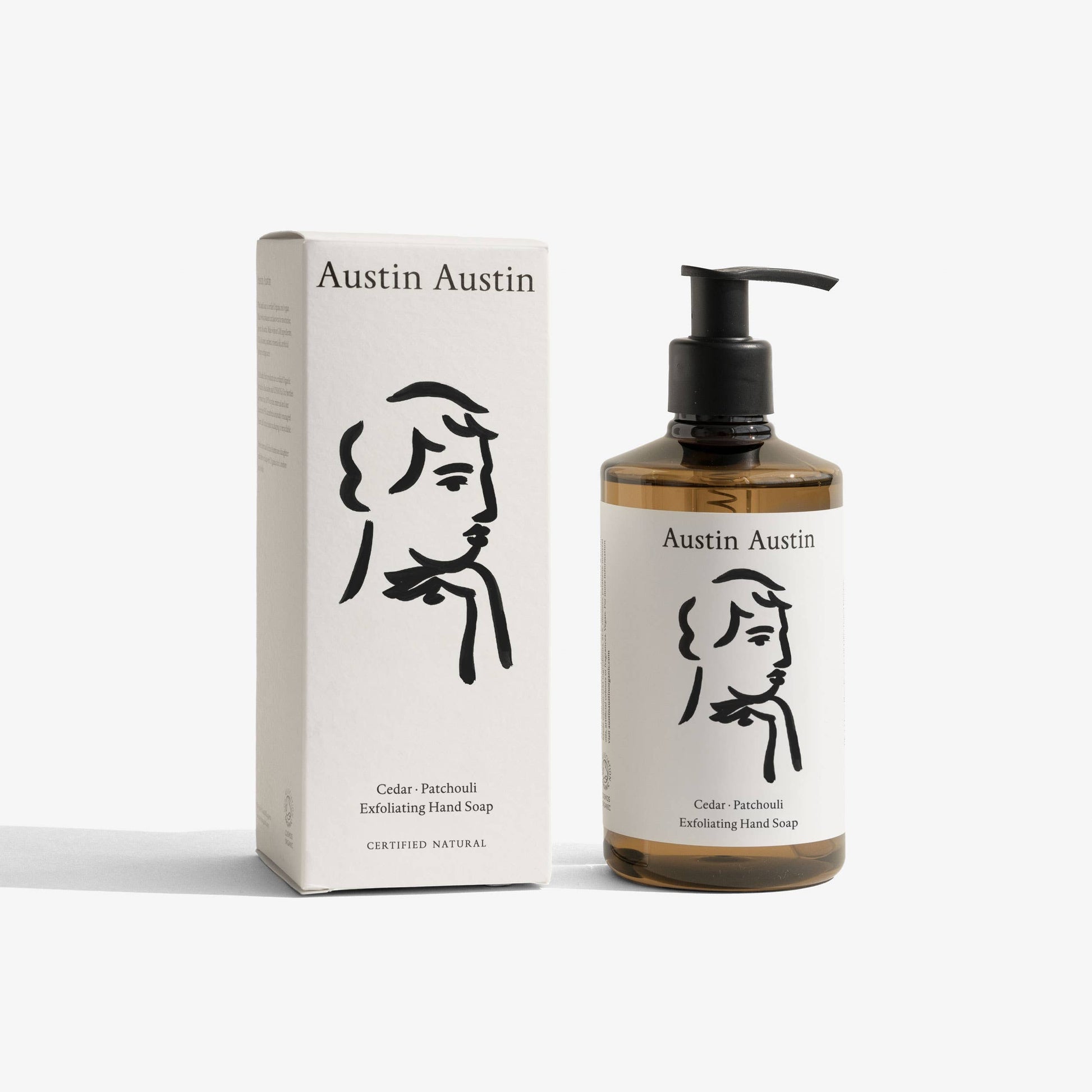 Austin Austin Cedar & Patchouli Exfoliating Hand Soap in a pump bottle, featuring natural cedar and patchouli scent with exfoliating beads.