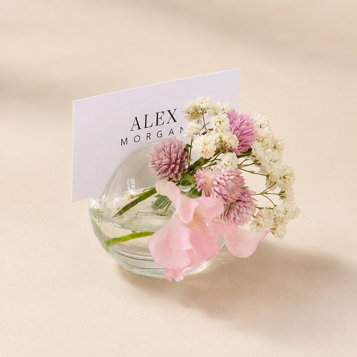 Accent Decor Blossom Glass Budvase and Name Card Holder featuring a delicate floral design and clear glass construction.