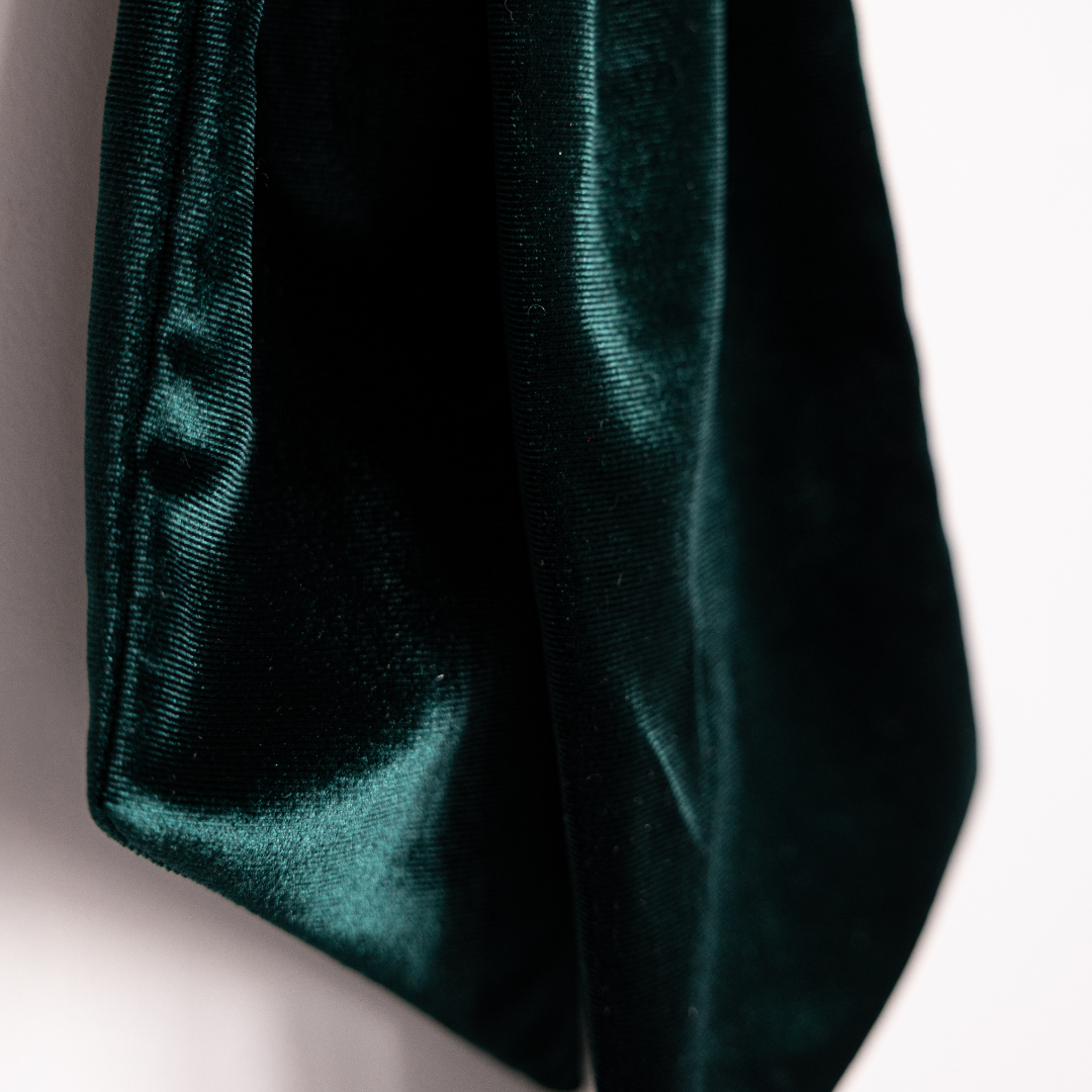 Emerald green velvet fabric bows by Luxe B Co, showcasing soft, luxurious material and elegant design for accessories or decorations.