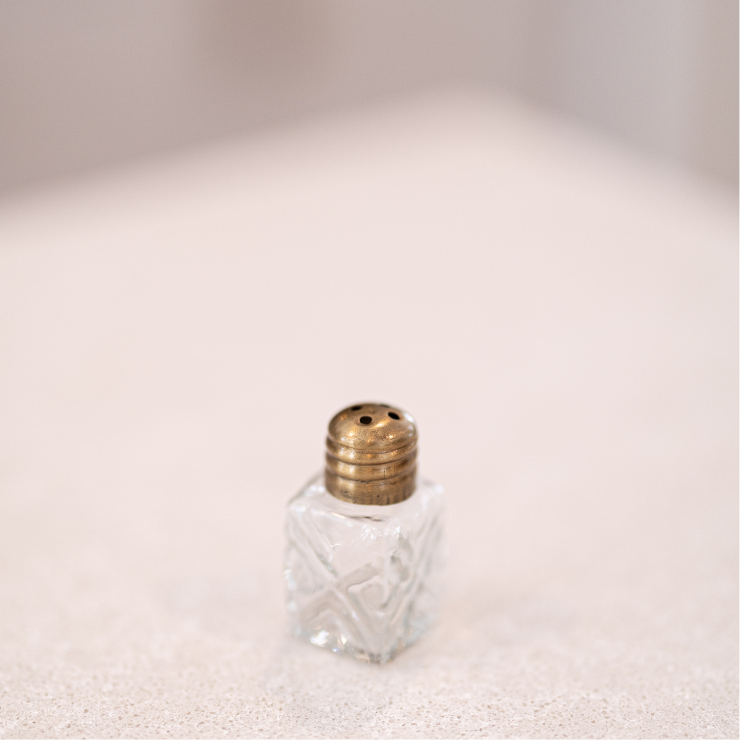 Engraved glass mini salt and pepper shakers by Luxe B Co with decorative engraved patterns on clear glass.