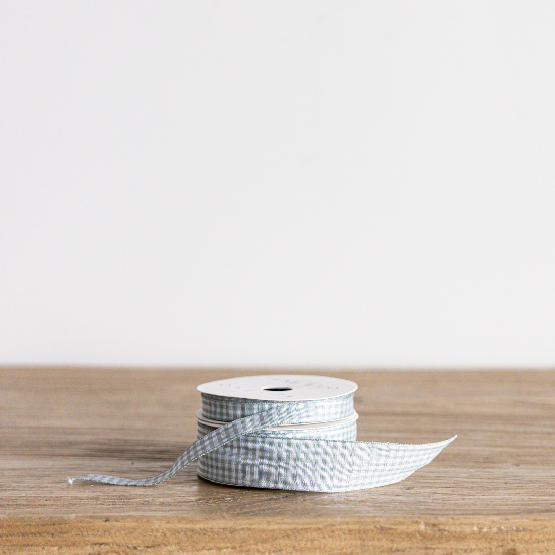 Seafoam blue gingham ribbon by Luxe B Co, featuring a classic checked pattern, ideal for gift wrapping and crafts.