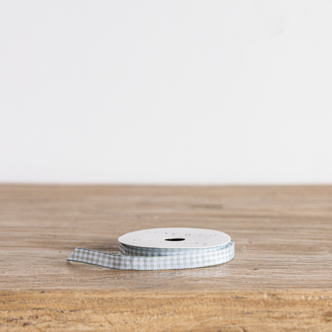 Seafoam blue gingham ribbon by Luxe B Co, featuring a classic checkered pattern and smooth satin finish.