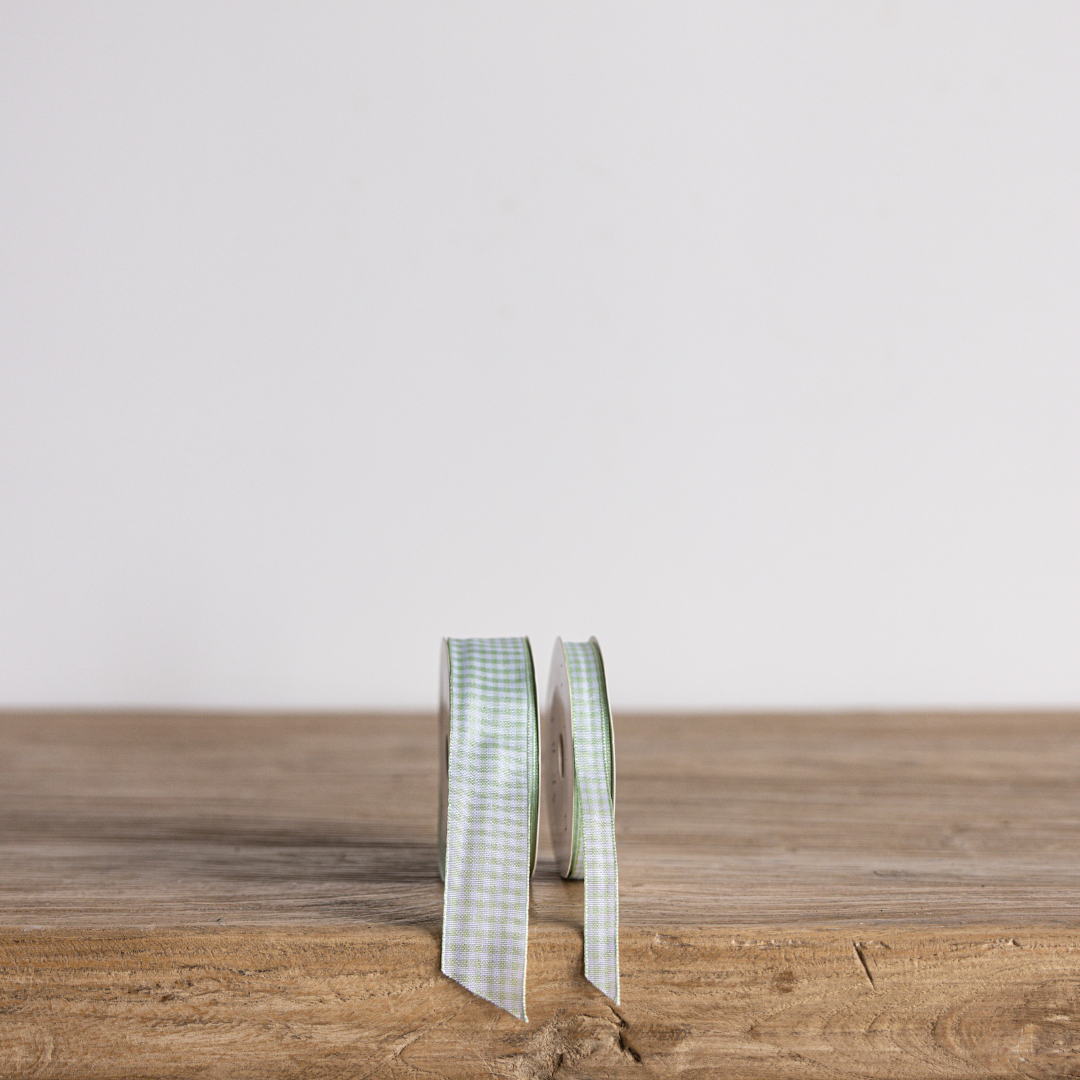 Spring green gingham ribbon by Luxe B Co, featuring a classic checkered pattern and soft fabric texture for craft and gift wrapping.