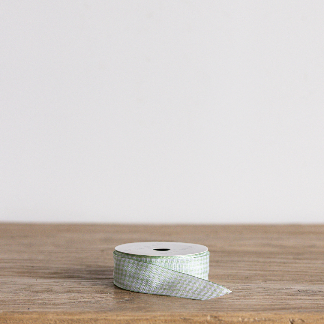 Spring green gingham ribbon by Luxe B Co, showcasing a lightweight fabric with classic checkered pattern and neatly finished edges.