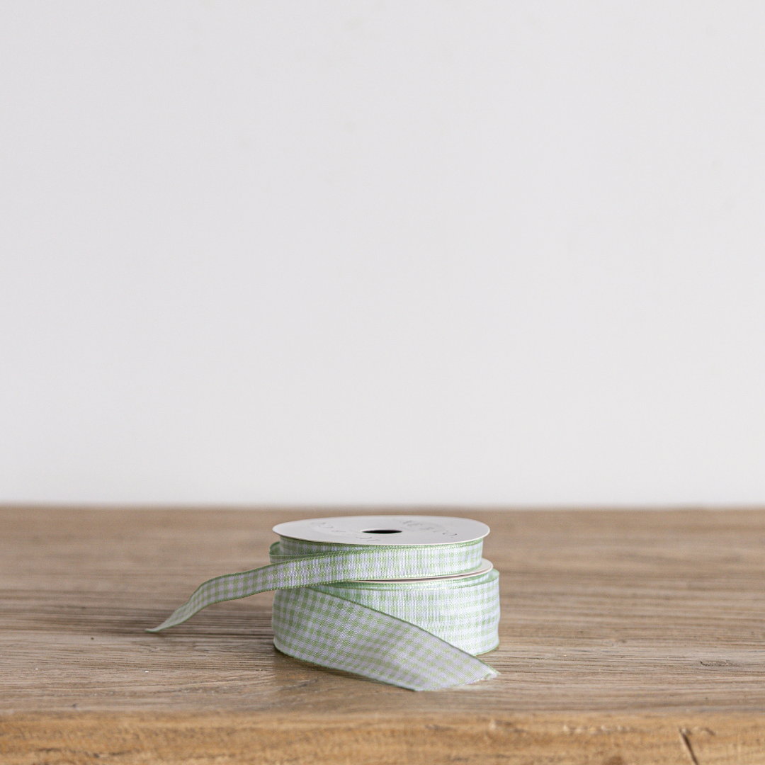 Spring green gingham ribbon by Luxe B Co, featuring a classic checkered pattern and lightweight fabric for craft and decor projects.
