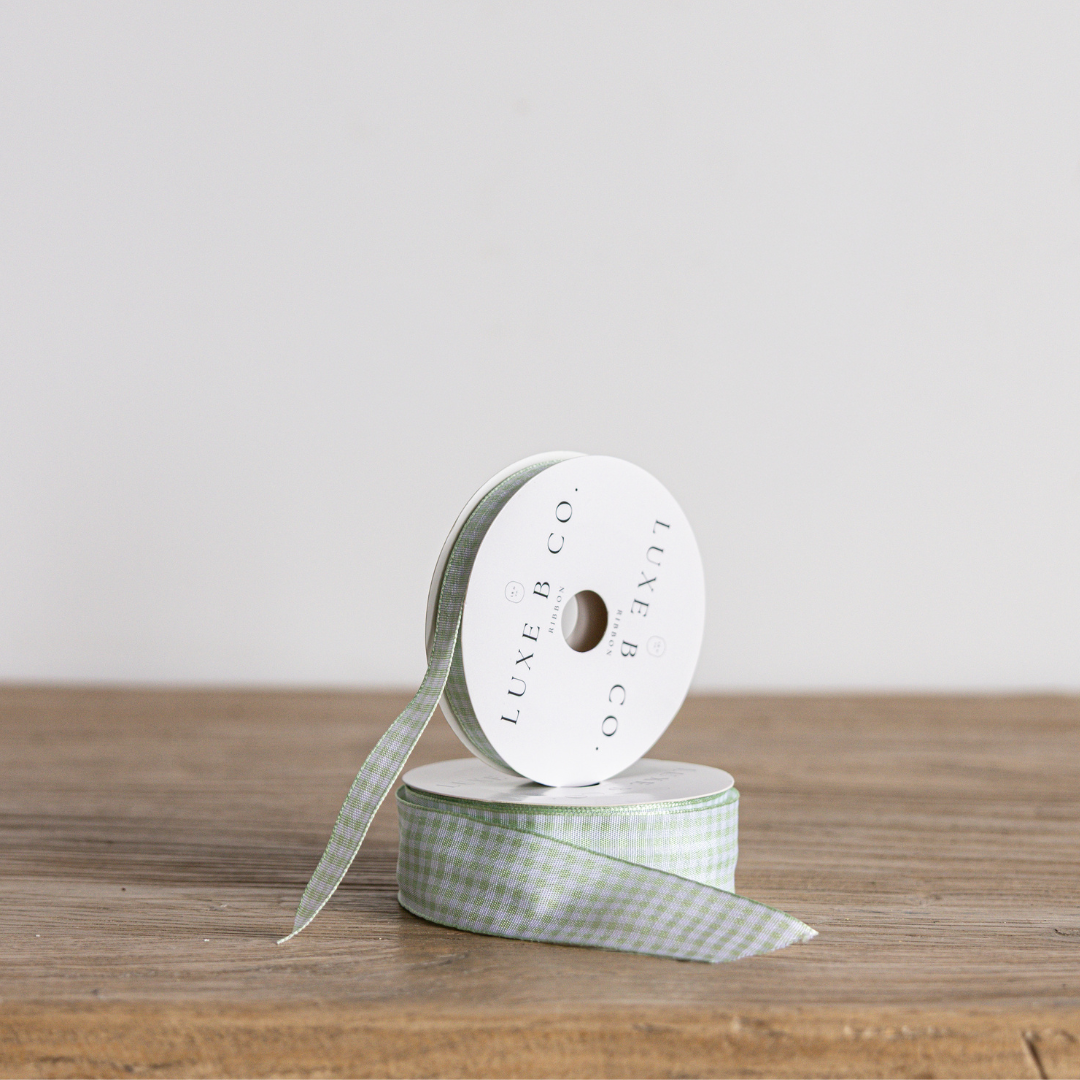 Spring green gingham ribbon by Luxe B Co, featuring a classic checked pattern and satin finish for craft and decoration projects.
