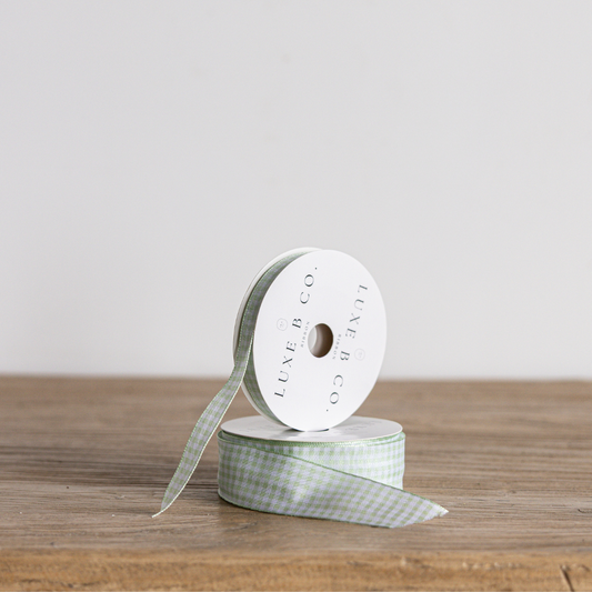 Spring green gingham ribbon by Luxe B Co, featuring a classic checked pattern and satin finish for craft and decoration projects.