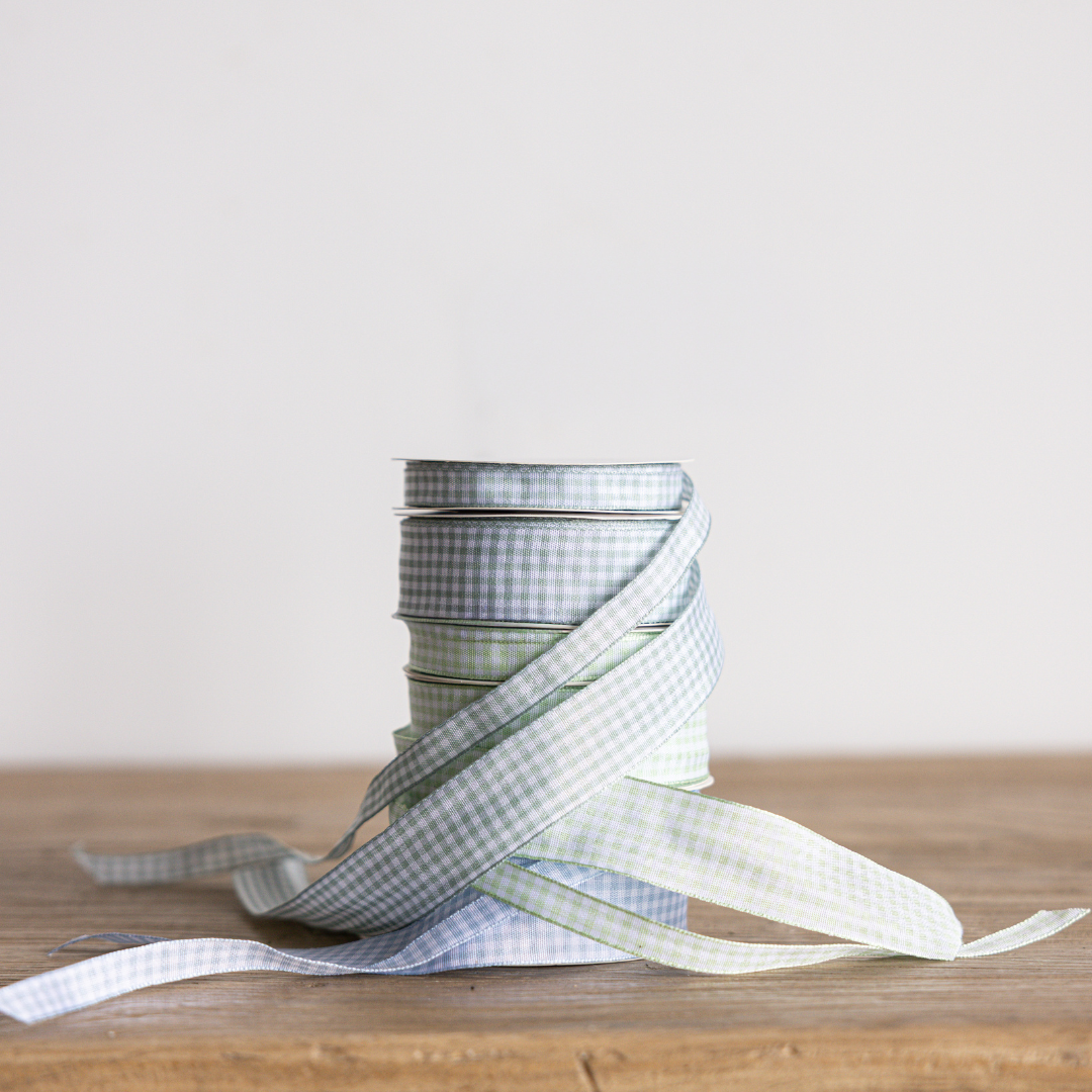 Sky blue gingham ribbon by Luxe B Co, close-up view showing soft fabric and classic checked pattern for craft or decoration use.