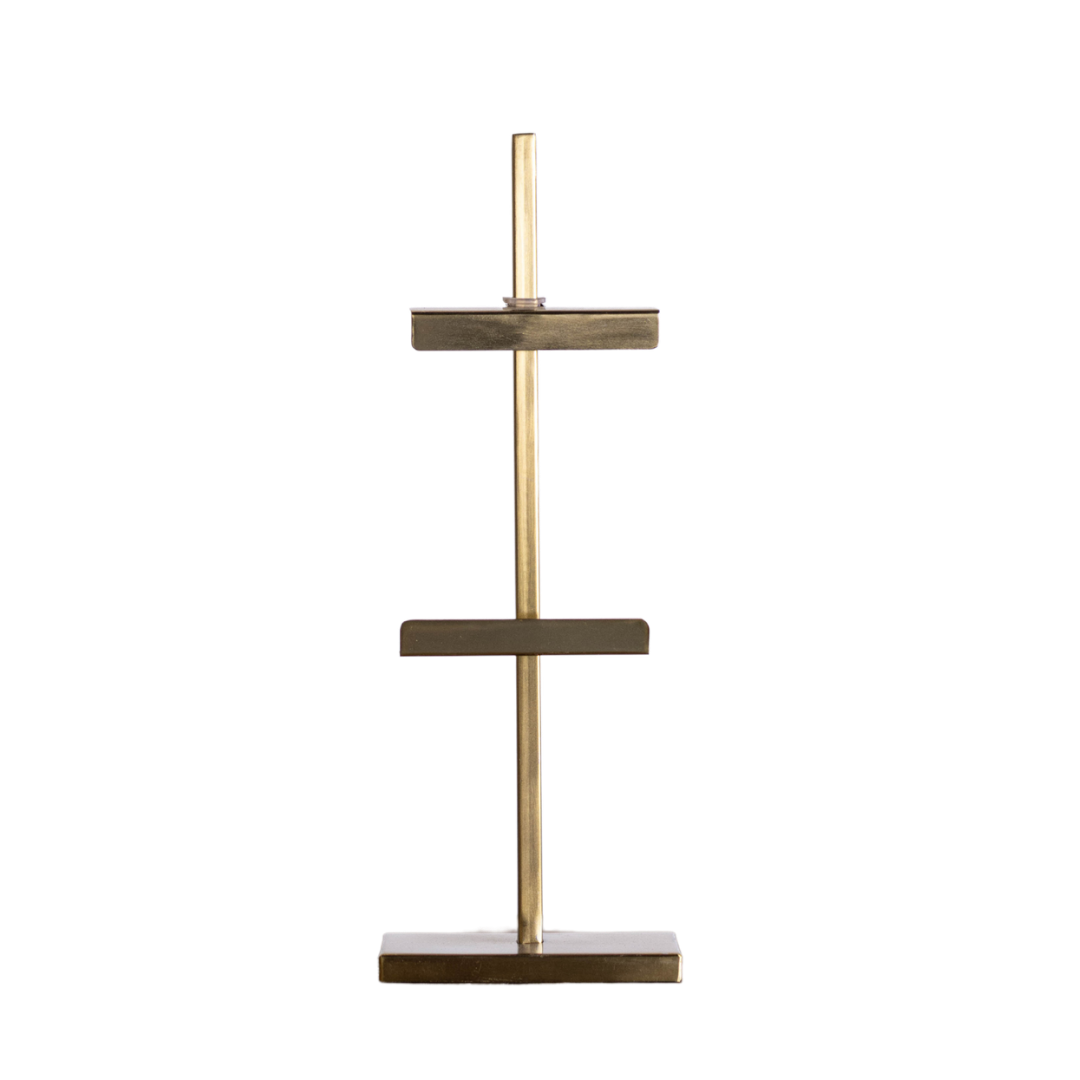 Gold adjustable art easel by Luxe B Co, featuring a sturdy frame and adjustable height for painting or display.