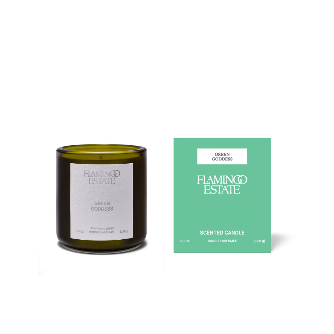 Luxe B Co Green Goddess Candle with a green glass jar and a lit wick, featuring a fresh, natural fragrance.