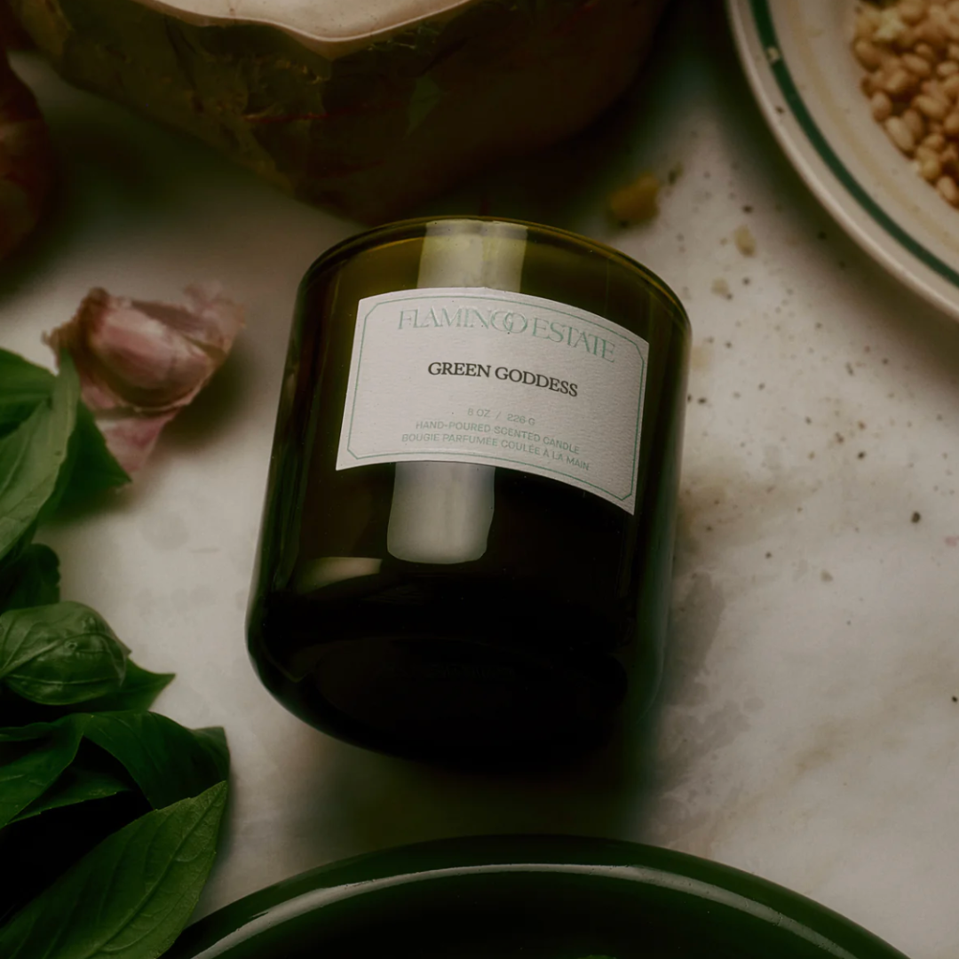 Green Goddess candle by Luxe B Co featuring a lush green container with a lit wick, highlighting a calming and elegant candle design.