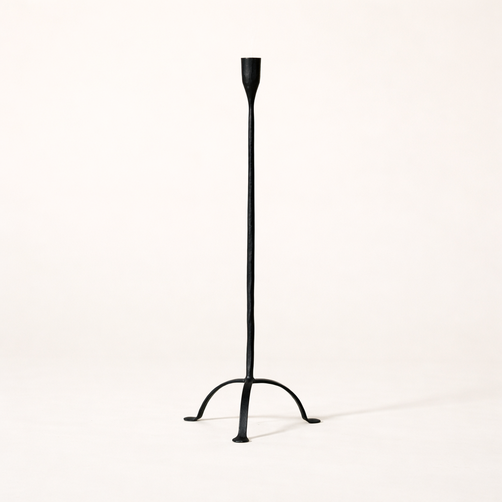 Hand-forged cast iron candleholder with footed design, small taper holder from Creative Co-op, showcasing rustic craftsmanship.