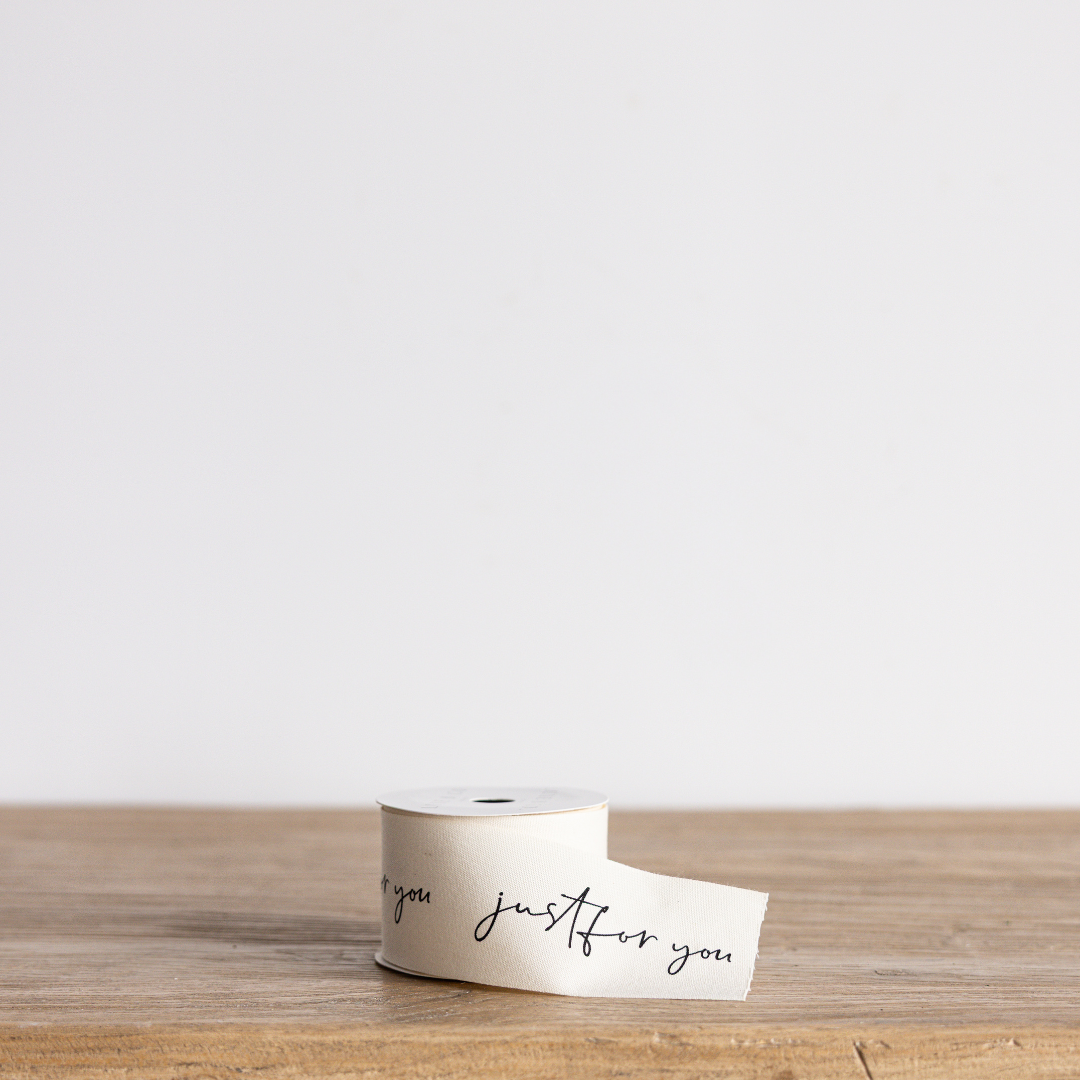 Cursive writing ribbon with "Just For You" design by Luxe B Co Wholesale, featuring elegant script on soft ribbon material.