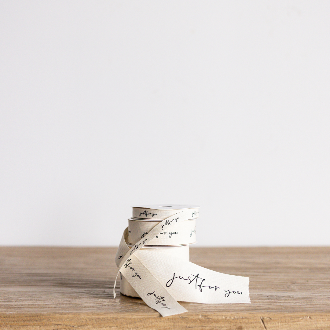 Elegant "Just For You" cursive writing ribbon by Luxe B Co Wholesale, featuring delicate script on soft ribbon material.