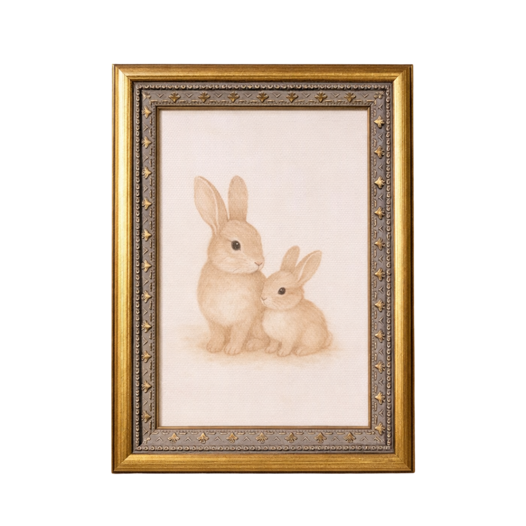 Antique-inspired brass mould framed art featuring playful little bunnies, by Luxe B Co, displayed in a stylish decorative wall piece.