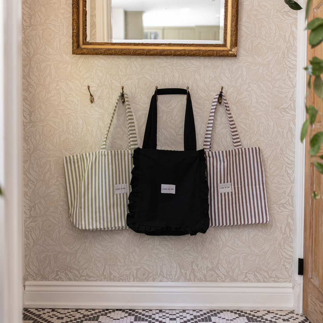 Luxe B Co. brown striped tote bag with sturdy handles and spacious interior, perfect for everyday use.