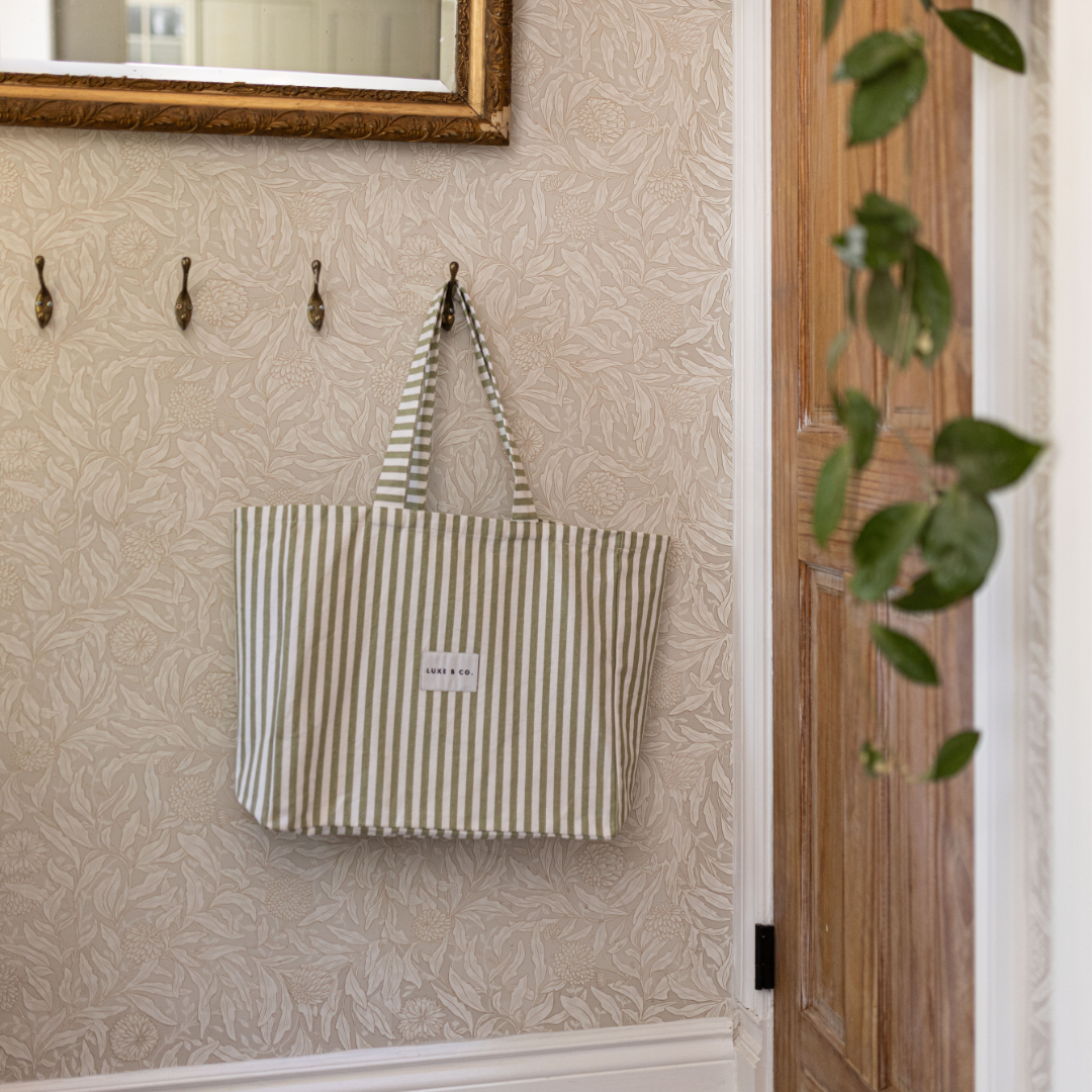 Green striped tote bag by Luxe B Co, featuring sturdy handles and spacious interior for everyday carry.