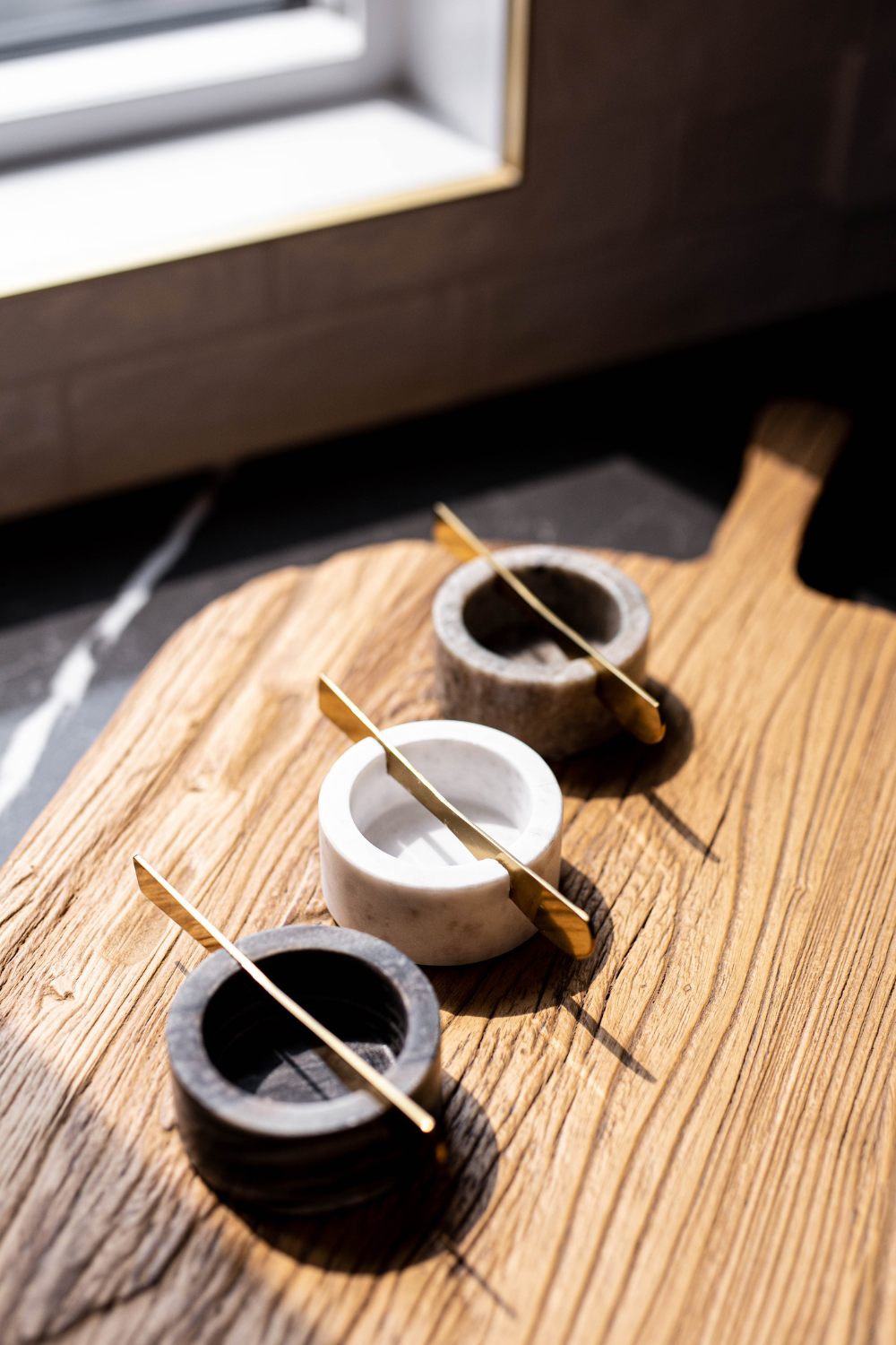 Marble charcuterie dish with integrated knife from Luxe B Co, perfect for serving cheeses, meats, and appetizers.