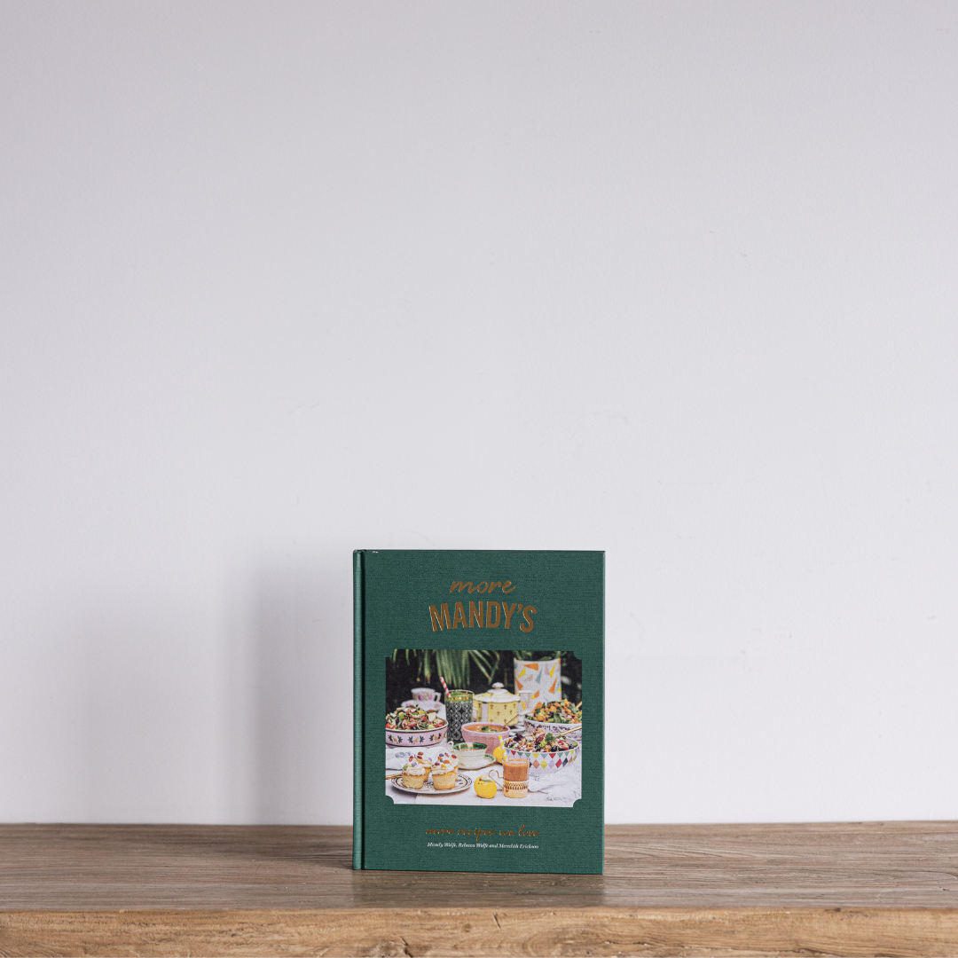 Luxe B Co's More Mandy's Cookbook cover featuring a colorful, inviting design with images of delicious dishes and recipes inside.