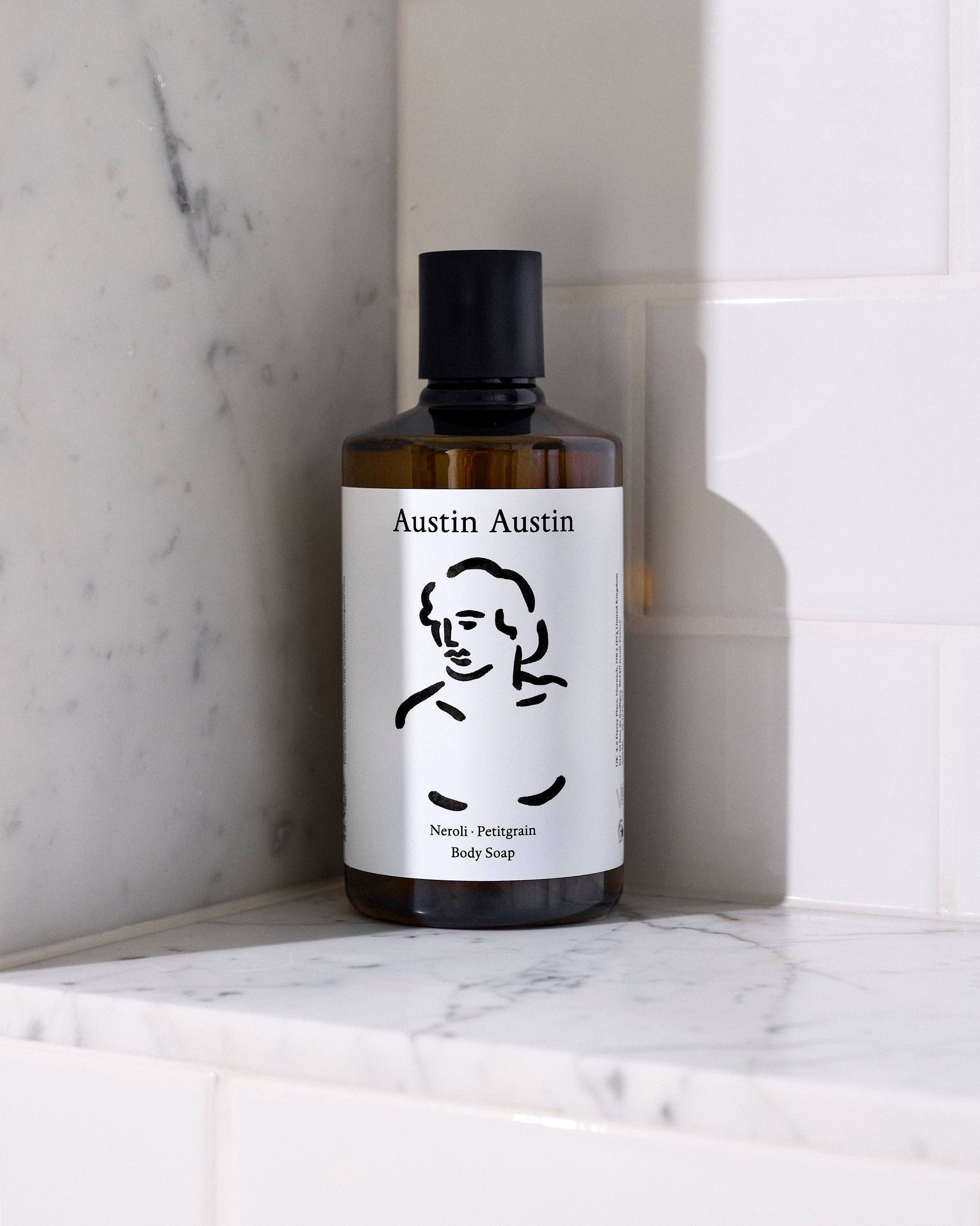Austin Austin Neroli and Petitgrain Body Wash in a clear pump bottle with a white label, showcasing fresh citrus and floral scent.