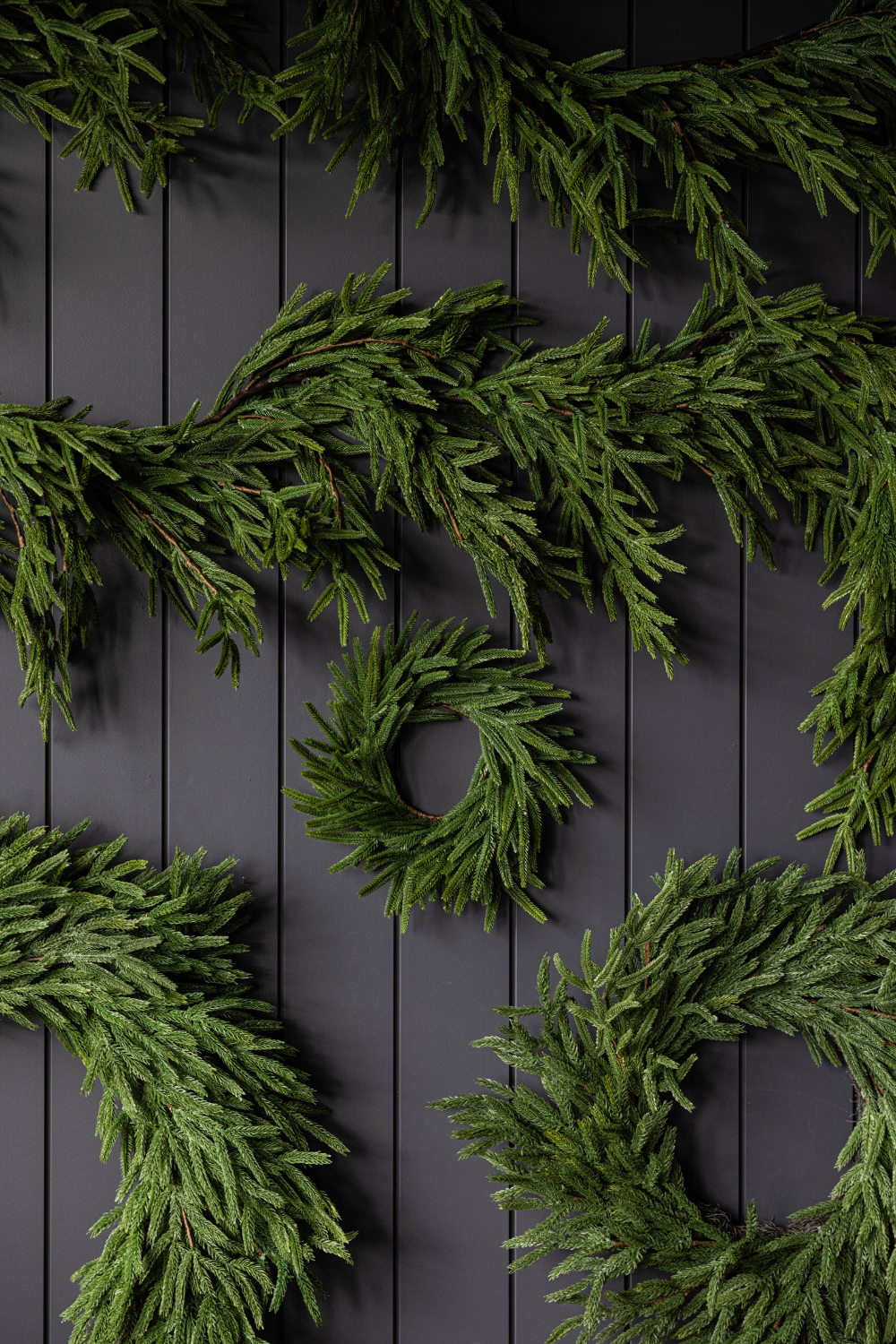 Real touch Norfolk wreath by Luxe B Co, 34-inch decorative wreath with lush faux greenery and realistic foliage.