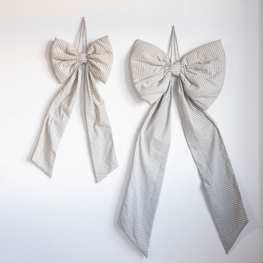 Oversized gray and blue striped bow by Luxe B Co, featuring large bow design with stylish striped pattern.