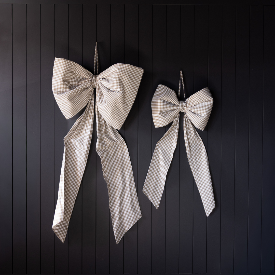 Oversized green gingham fabric bow by Luxe B Co, stylish accessory with bold, checkered pattern and large, elegant design.