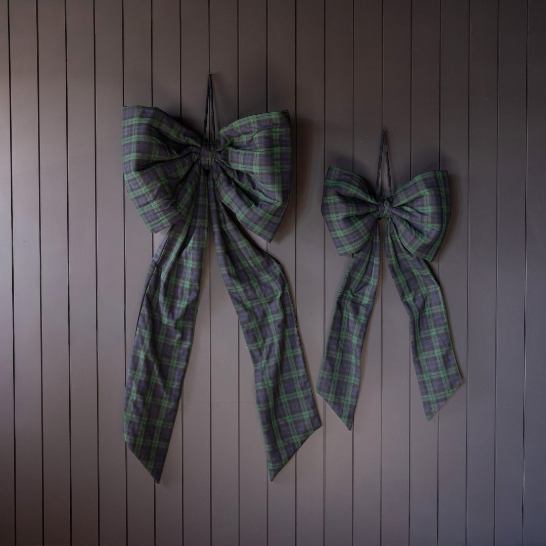 Oversized green plaid bow by Luxe B Co, featuring a large, stylish bow with a classic plaid pattern.