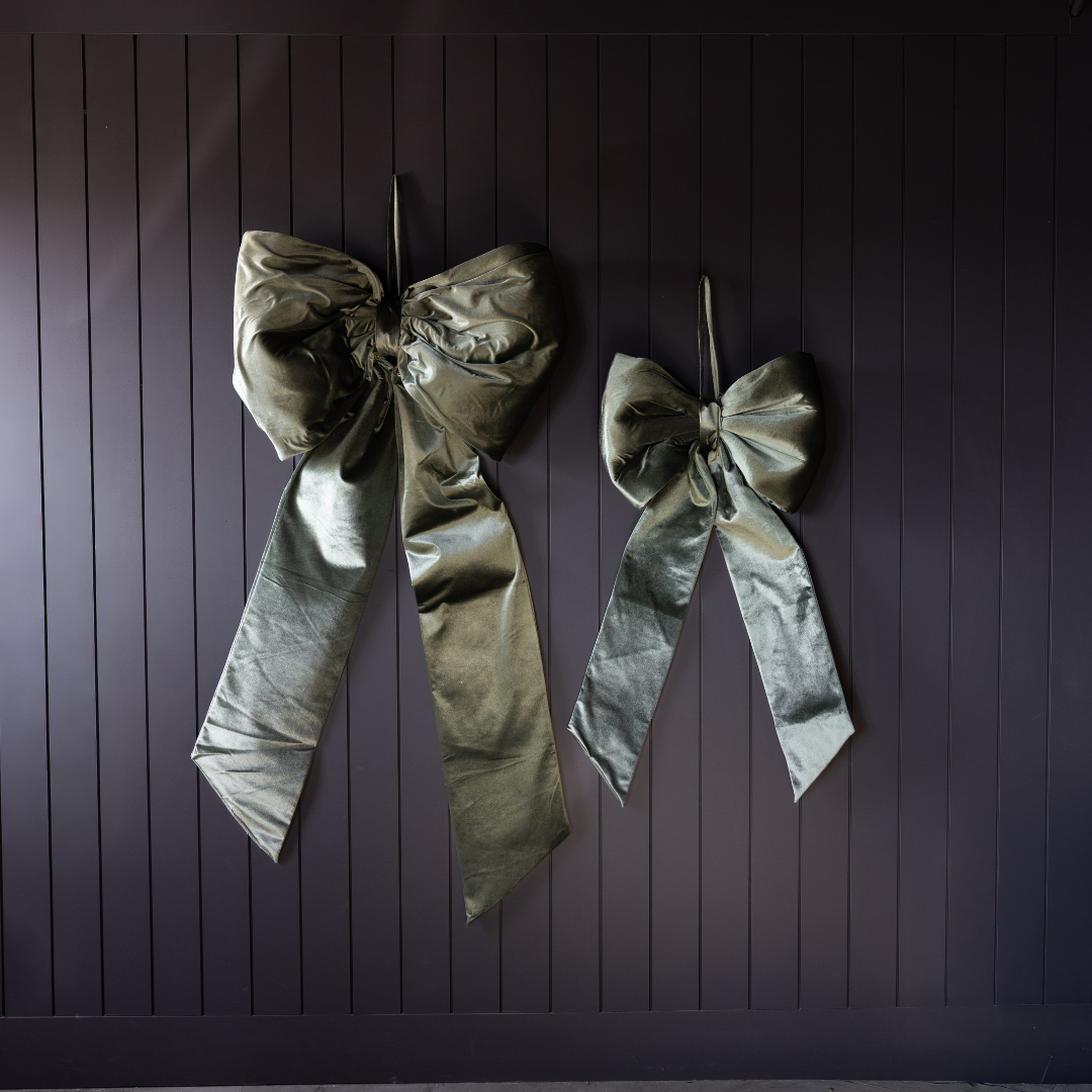 Large sage velvet bow by Luxe B Co, featuring soft fabric and oversized design, perfect for elegant hair accessories or decor.